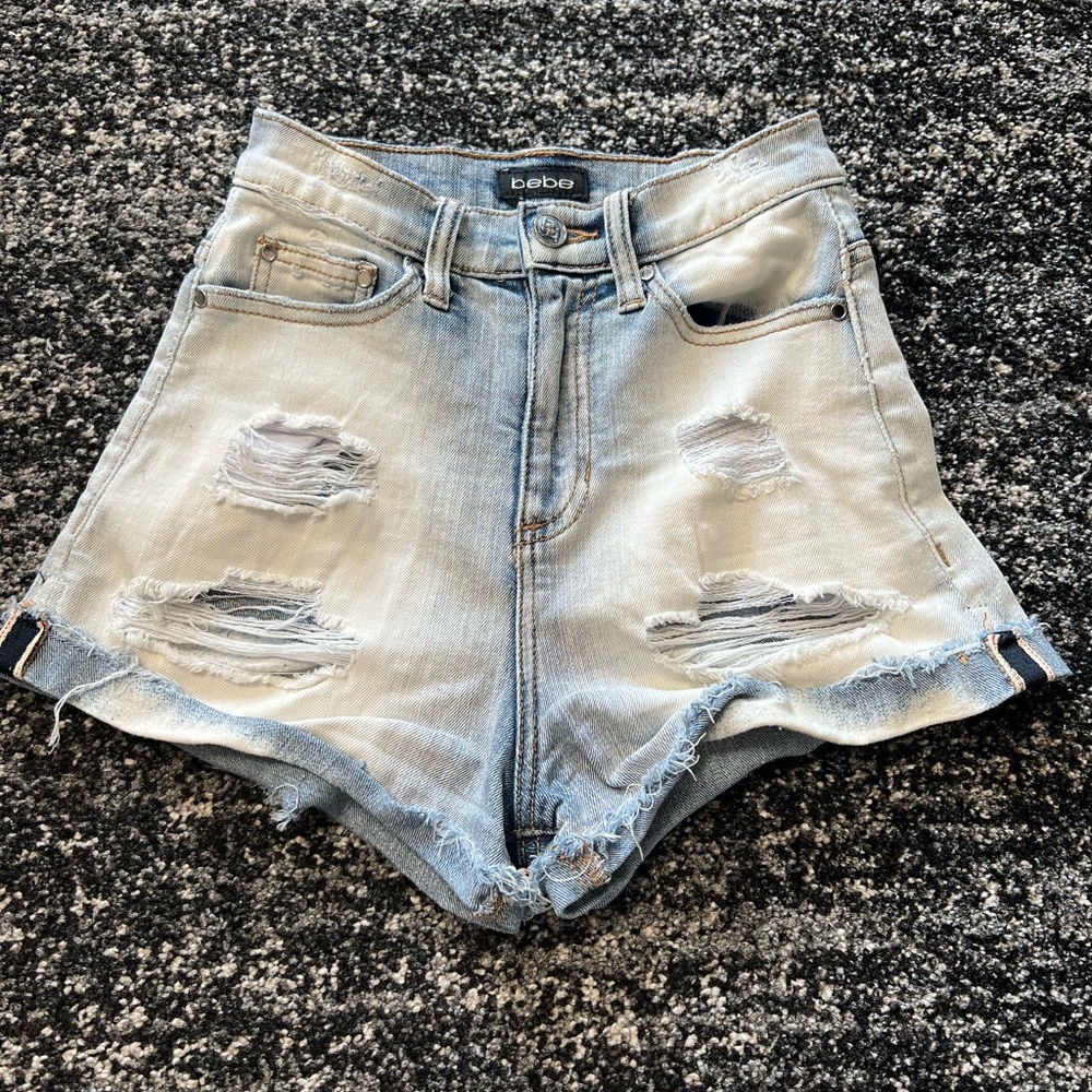 Bebe Denim shorts. High Waisted, Size 24, Blue and white mix color.